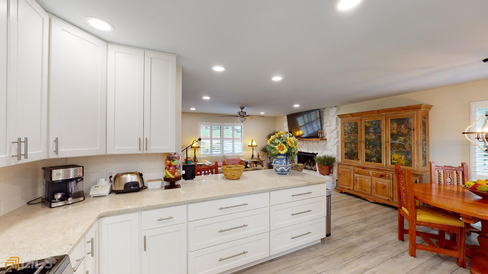 1137 Magnolia Drive Villa Rica, GA 30180 - Photo 11 of 44 a view of a kitchen with cabinets stainless steel appliances wooden floor and a window