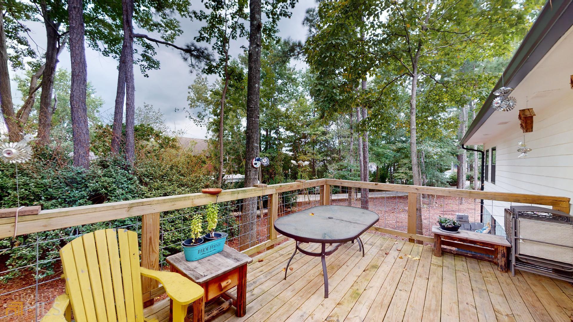 1137 Magnolia Drive Villa Rica, GA 30180 - Photo 12 of 44 a view of balcony with wooden floor and outdoor seating