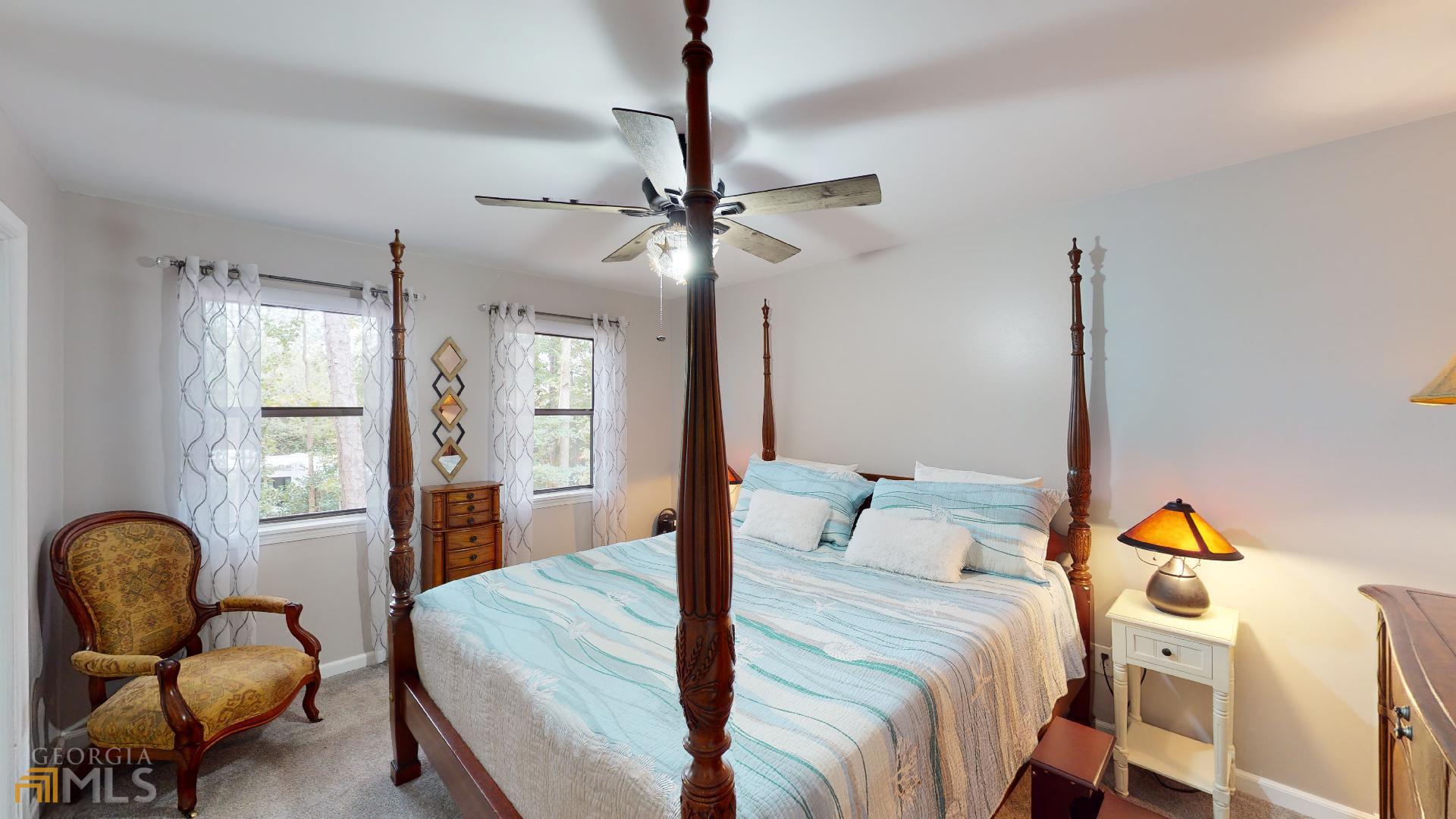 1137 Magnolia Drive Villa Rica, GA 30180 - Photo 14 of 44 a bedroom with a bed and furniture