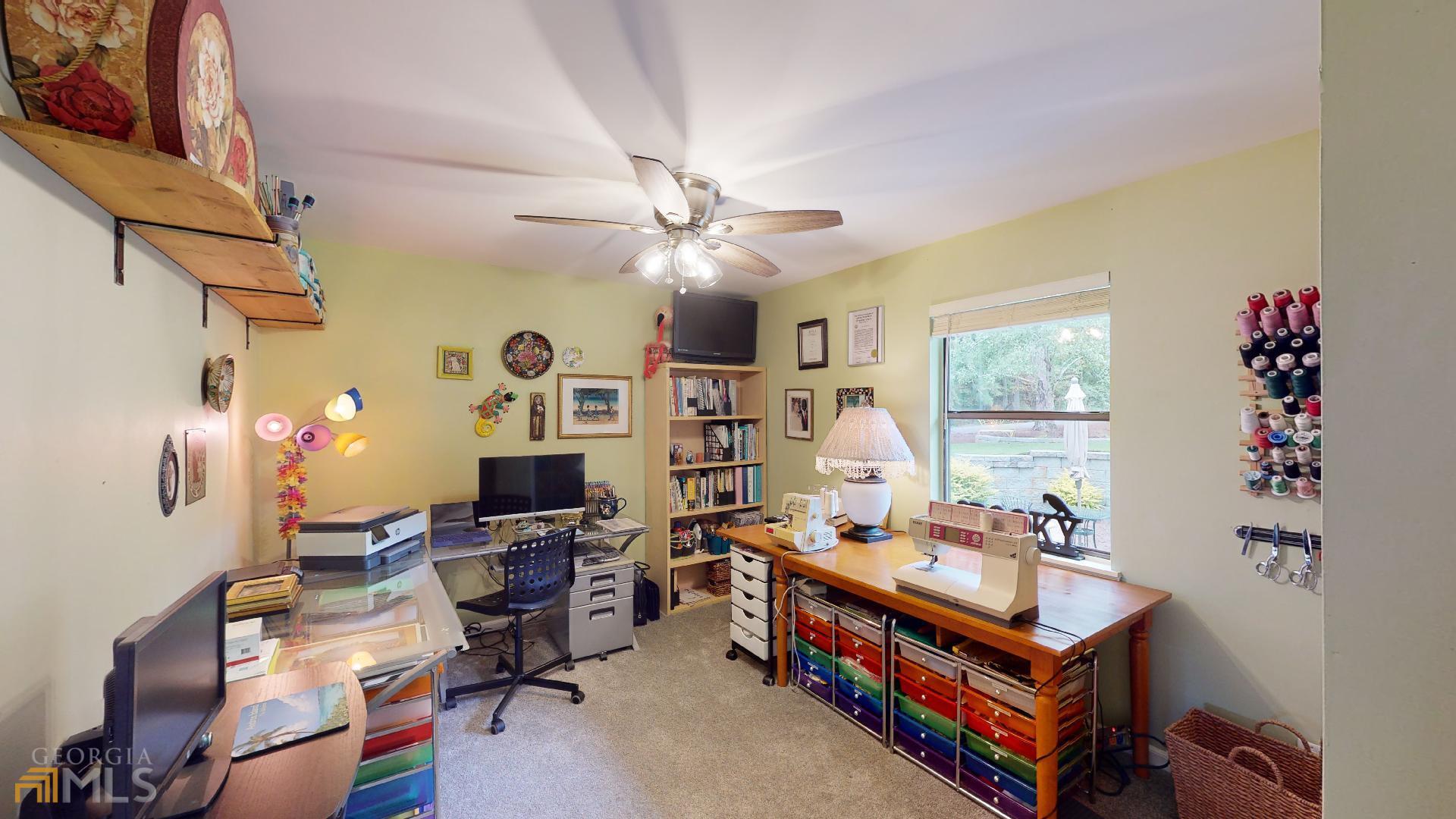 1137 Magnolia Drive Villa Rica, GA 30180 - Photo 18 of 44 a living room with furniture and a flat screen tv