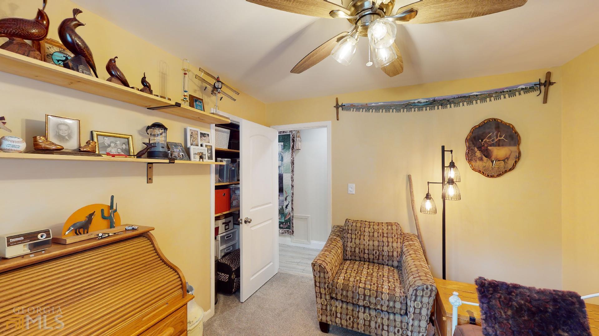 1137 Magnolia Drive Villa Rica, GA 30180 - Photo 21 of 44 a bedroom with a bed and cabinets