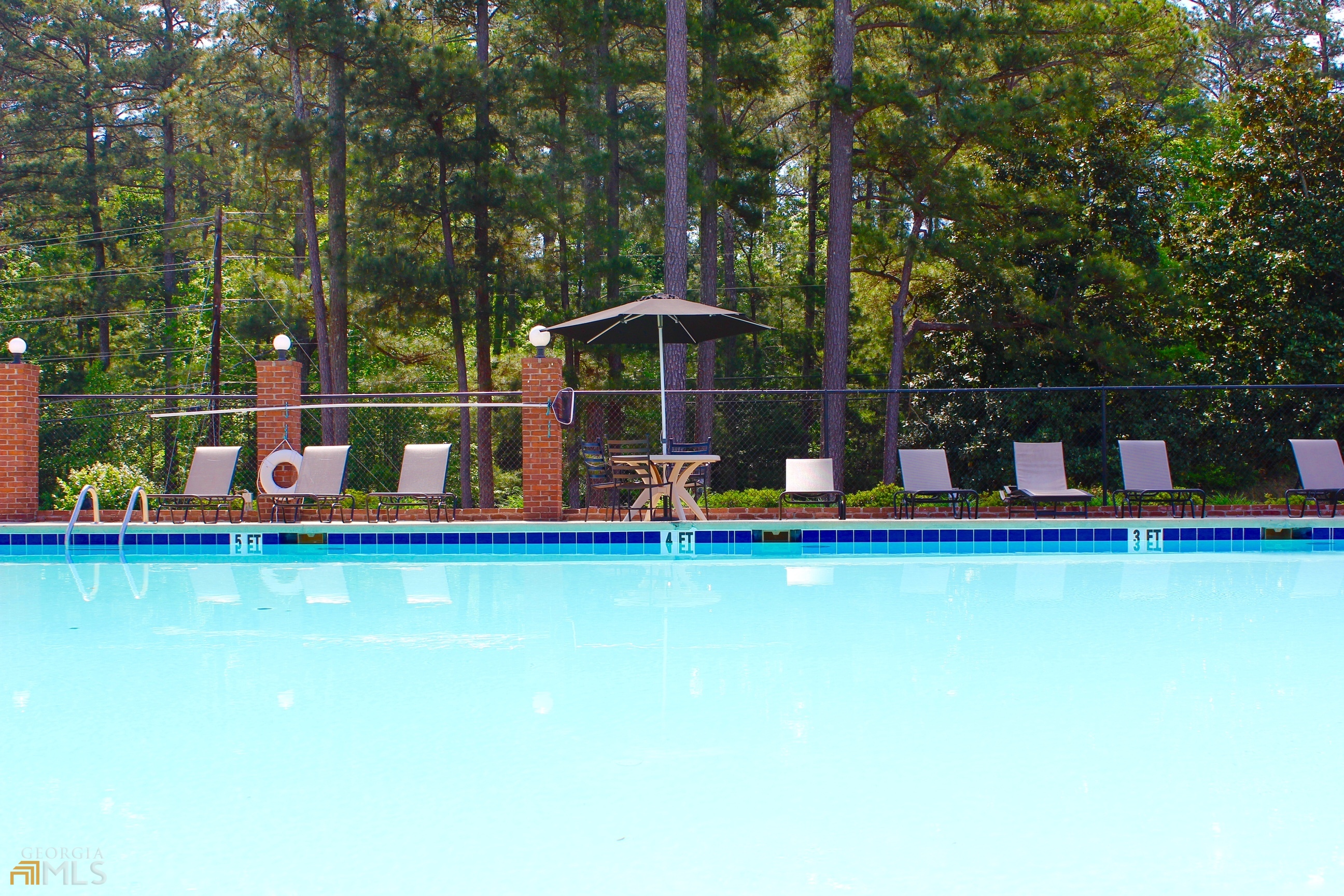 1137 Magnolia Drive Villa Rica, GA 30180 - Photo 32 of 44 a view of a swimming pool with an outdoor seating