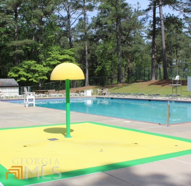 1137 Magnolia Drive Villa Rica, GA 30180 - Photo 41 of 44 a view of a swimming pool with an outdoor space and seating area