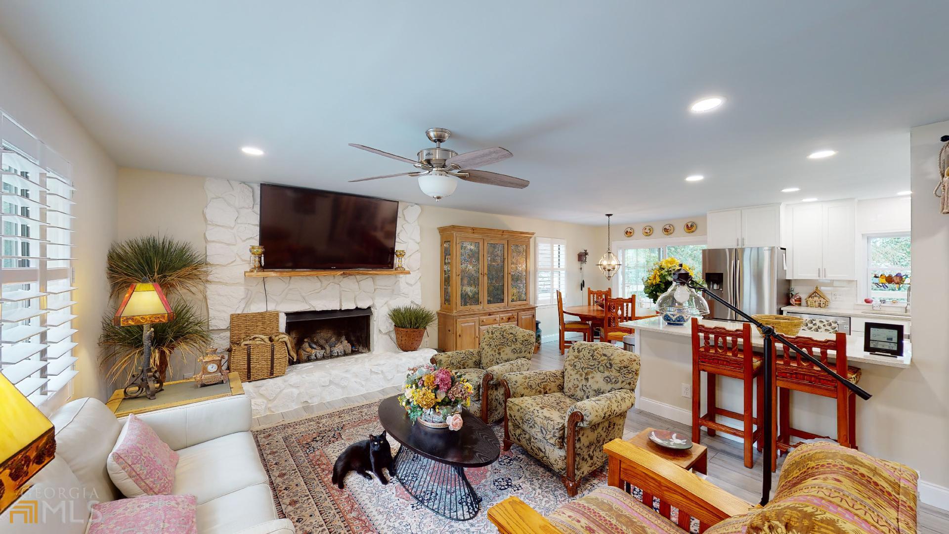 1137 Magnolia Drive Villa Rica, GA 30180 - Photo 6 of 44 a living room with fireplace furniture and a flat screen tv