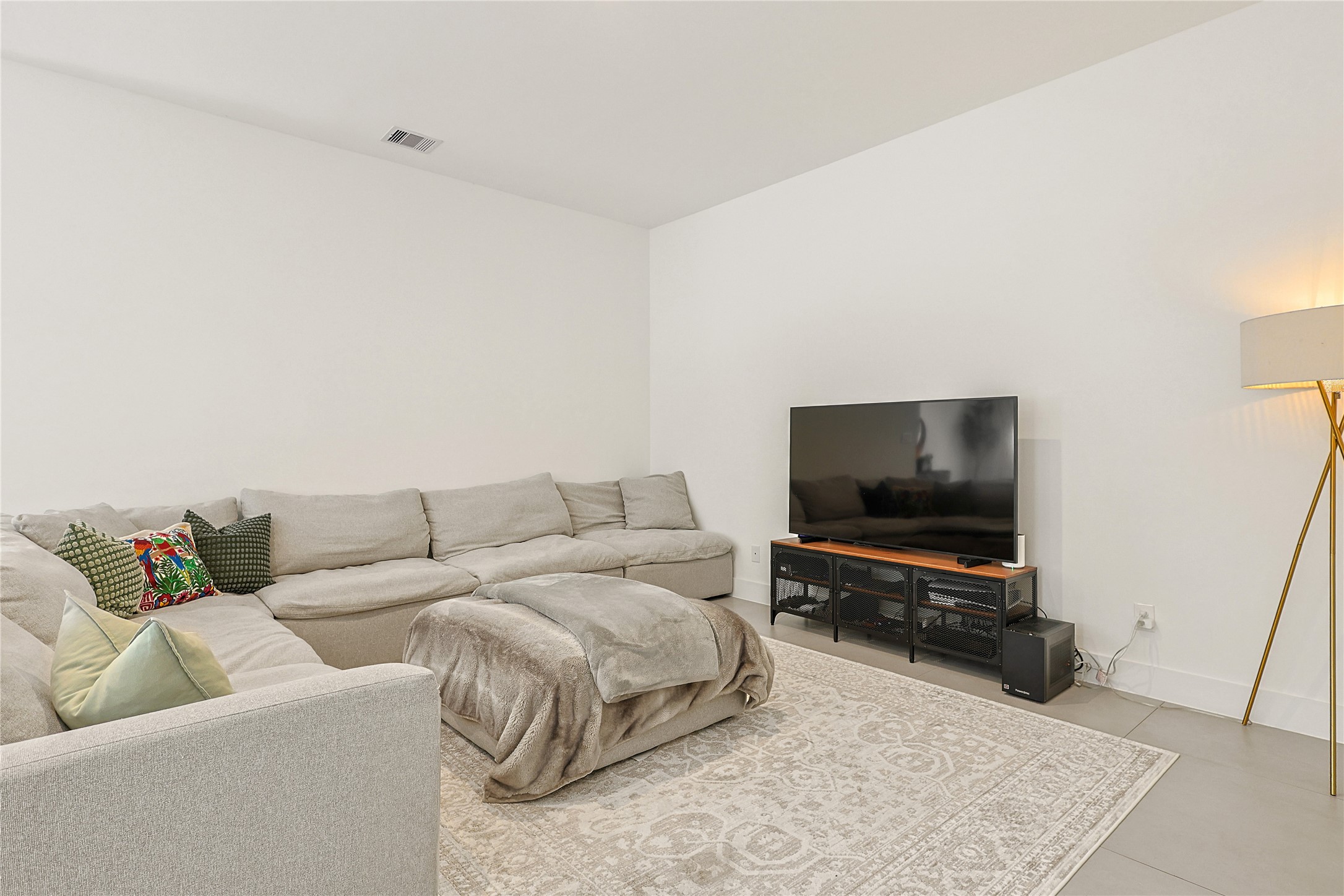 1550 Ashway Street Conroe, TX 77385 - Photo 13 of 34 a living room with furniture and a flat screen tv