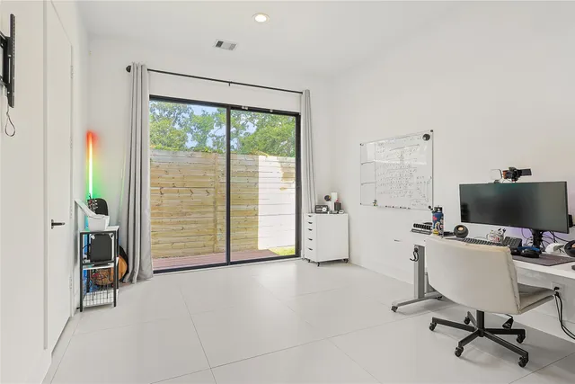 a bedroom with a bed and chair