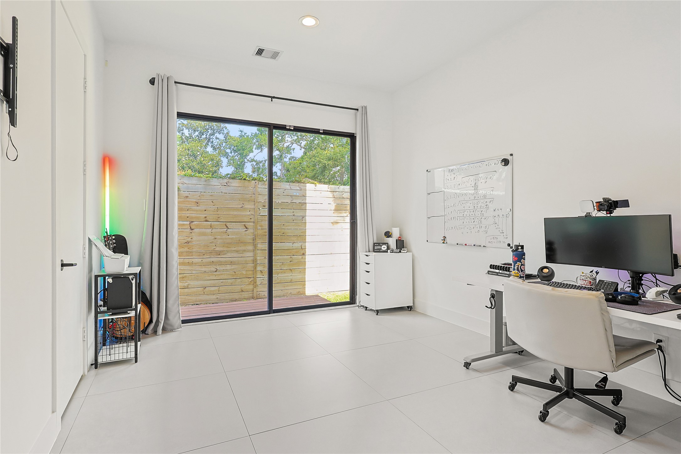 1550 Ashway Street Conroe, TX 77385 - Photo 19 of 34 a view of a workspace with furniture and a window