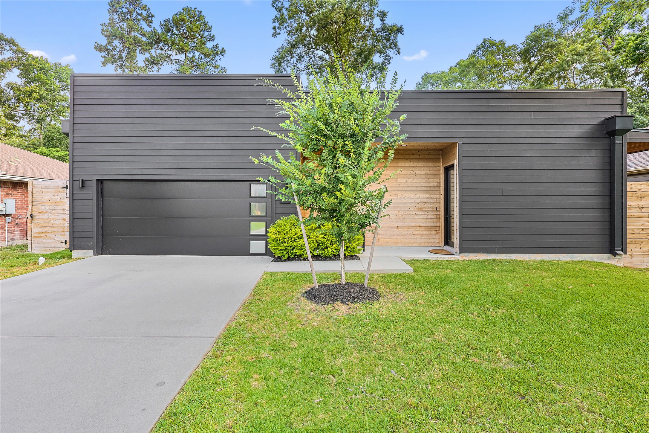 1550 Ashway Street Conroe, TX 77385 - Photo 2 of 34 a small garden in the back yard