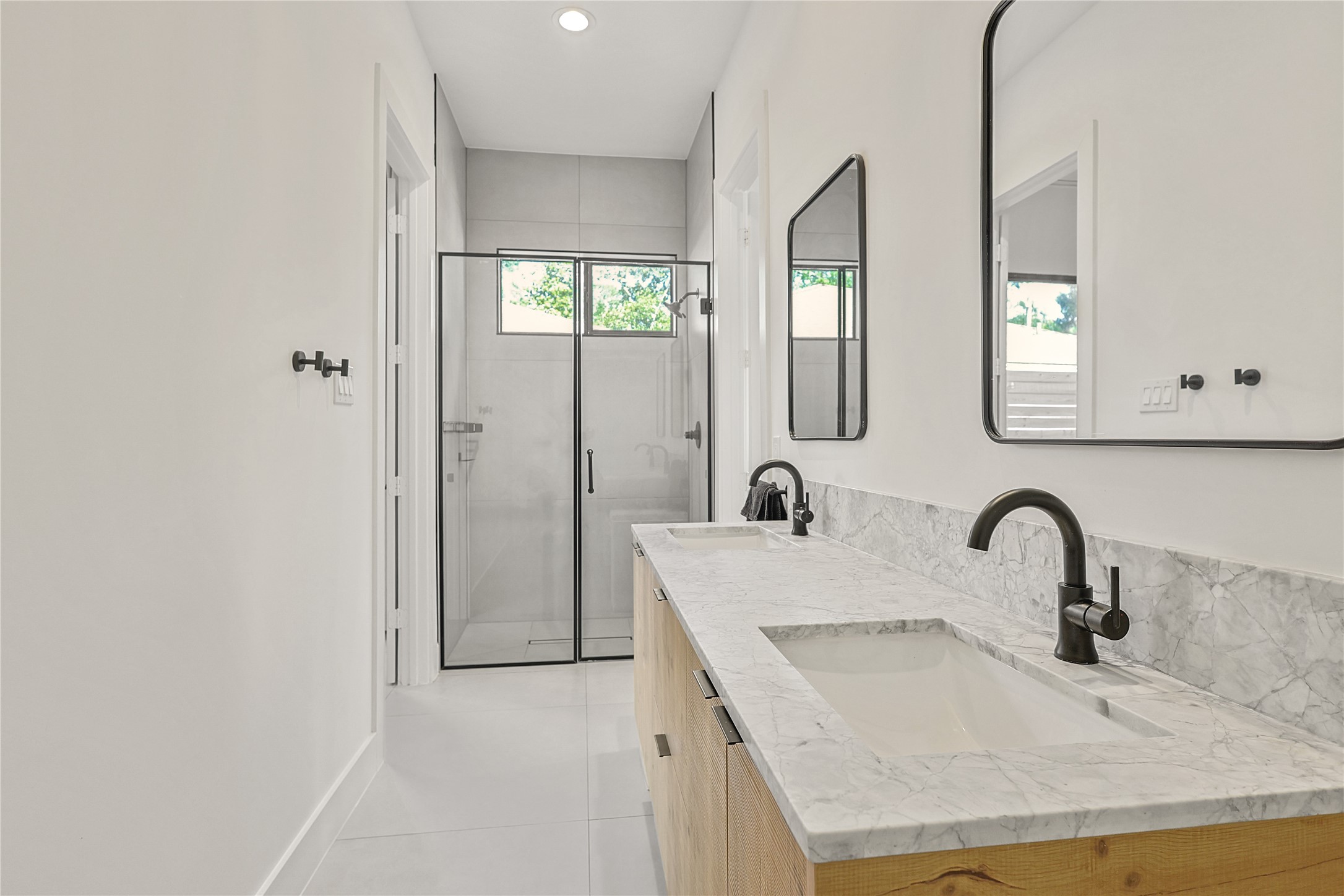1550 Ashway Street Conroe, TX 77385 - Photo 27 of 34 a bathroom with a sink and mirror with window