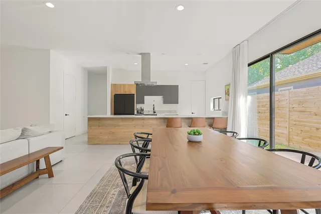 a room with table and potted plants