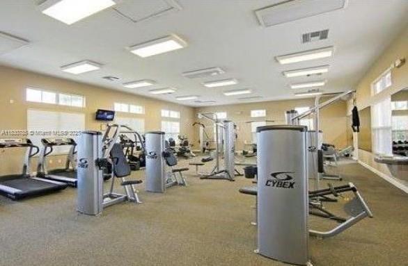 22911 Southwest 88th Place, Unit 721 Cutler Bay, FL 33190 - Photo 19 of 20 a view of a room with gym equipment