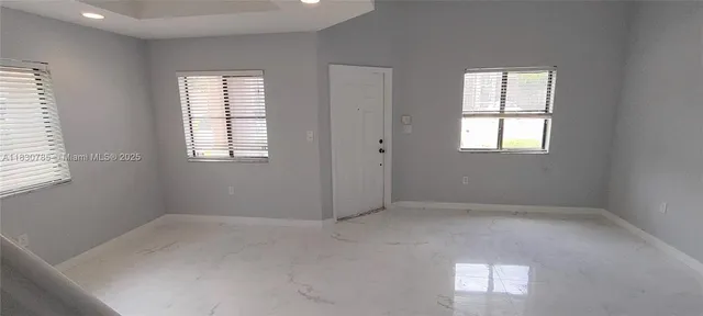 an empty room with windows