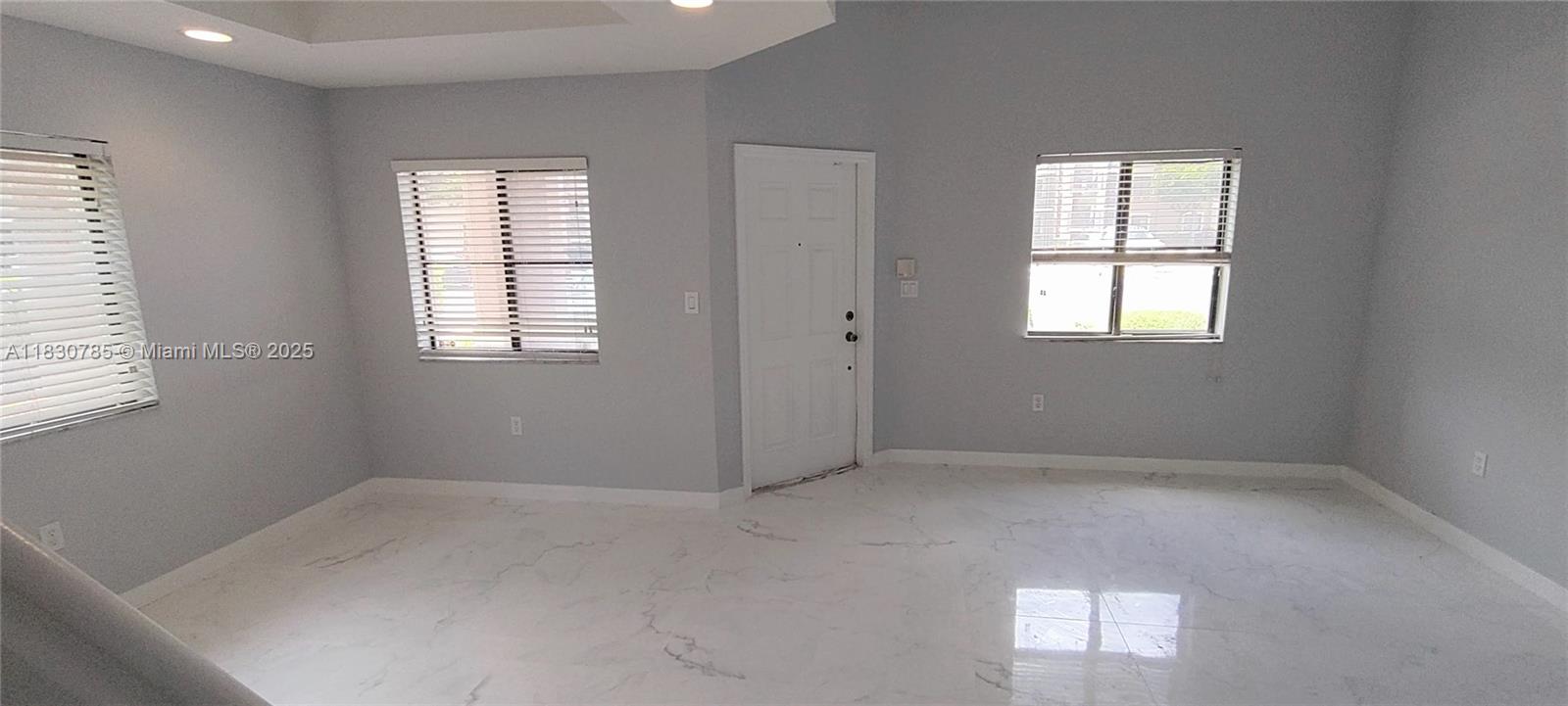 22911 Southwest 88th Place, Unit 721 Cutler Bay, FL 33190 - Photo 5 of 20 an empty room with windows