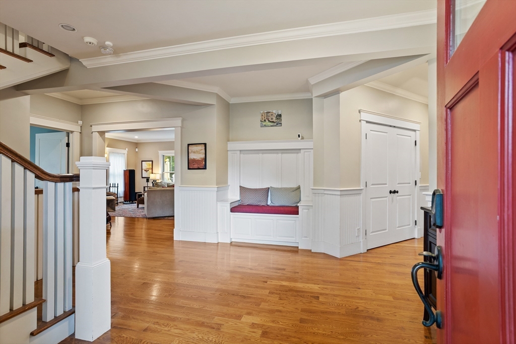 5 Walnut Street Lexington, MA 02421 - Photo 2 of 34 a view of a livingroom with wooden floor and kitchen space