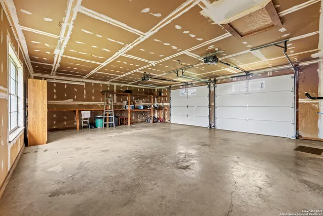 a view of empty room with wooden ceiling
