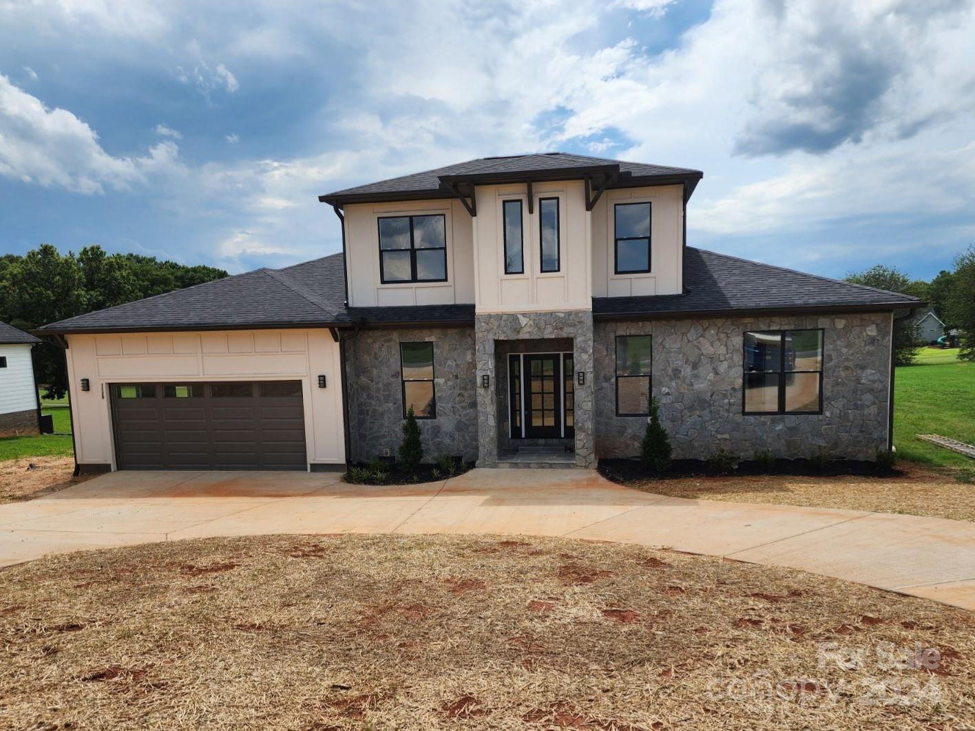 a front view of a house with yard