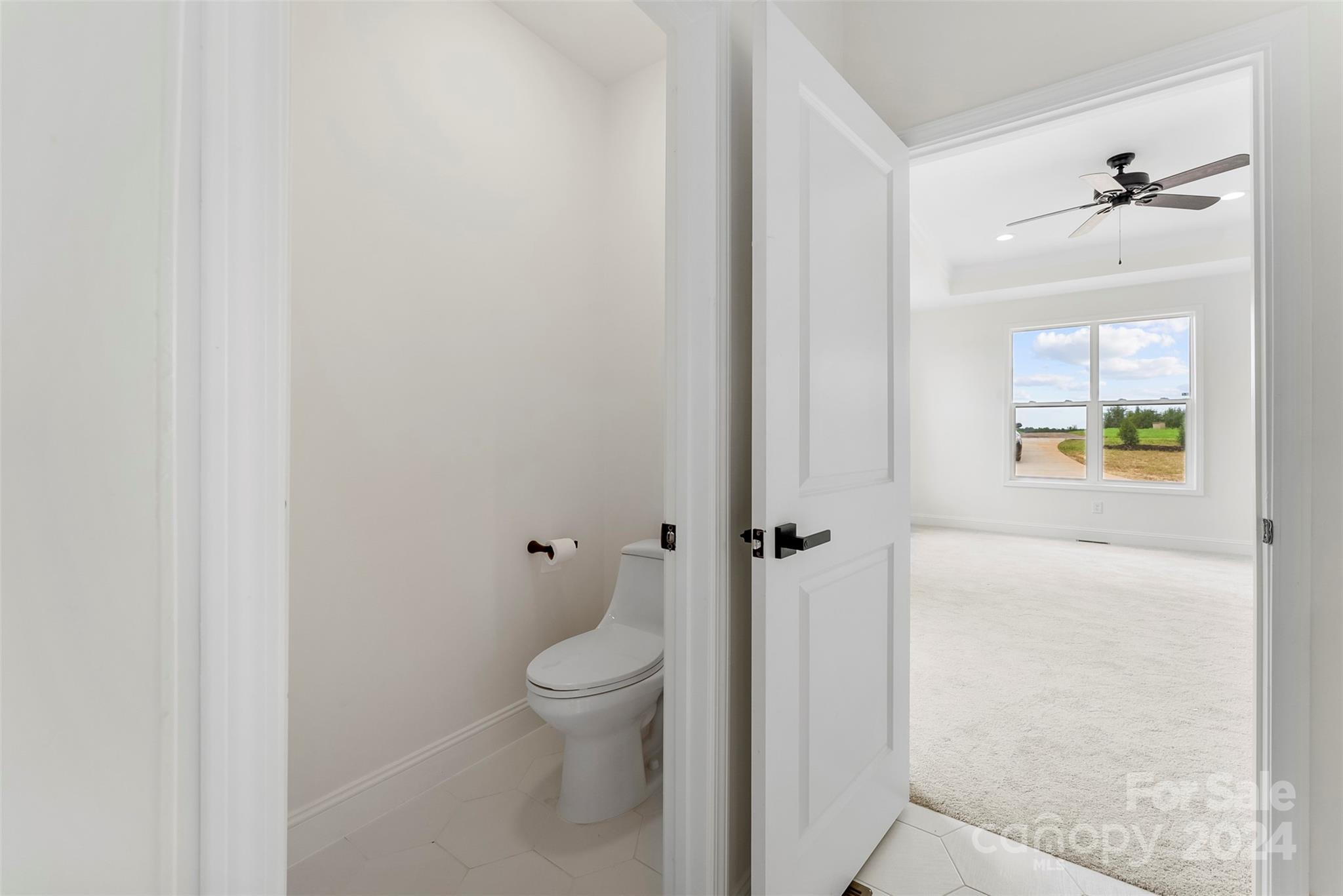 1129 Stoney Point Road Kings Mountain, NC 28086 - Photo 16 of 45 a bathroom with a toilet and a shower
