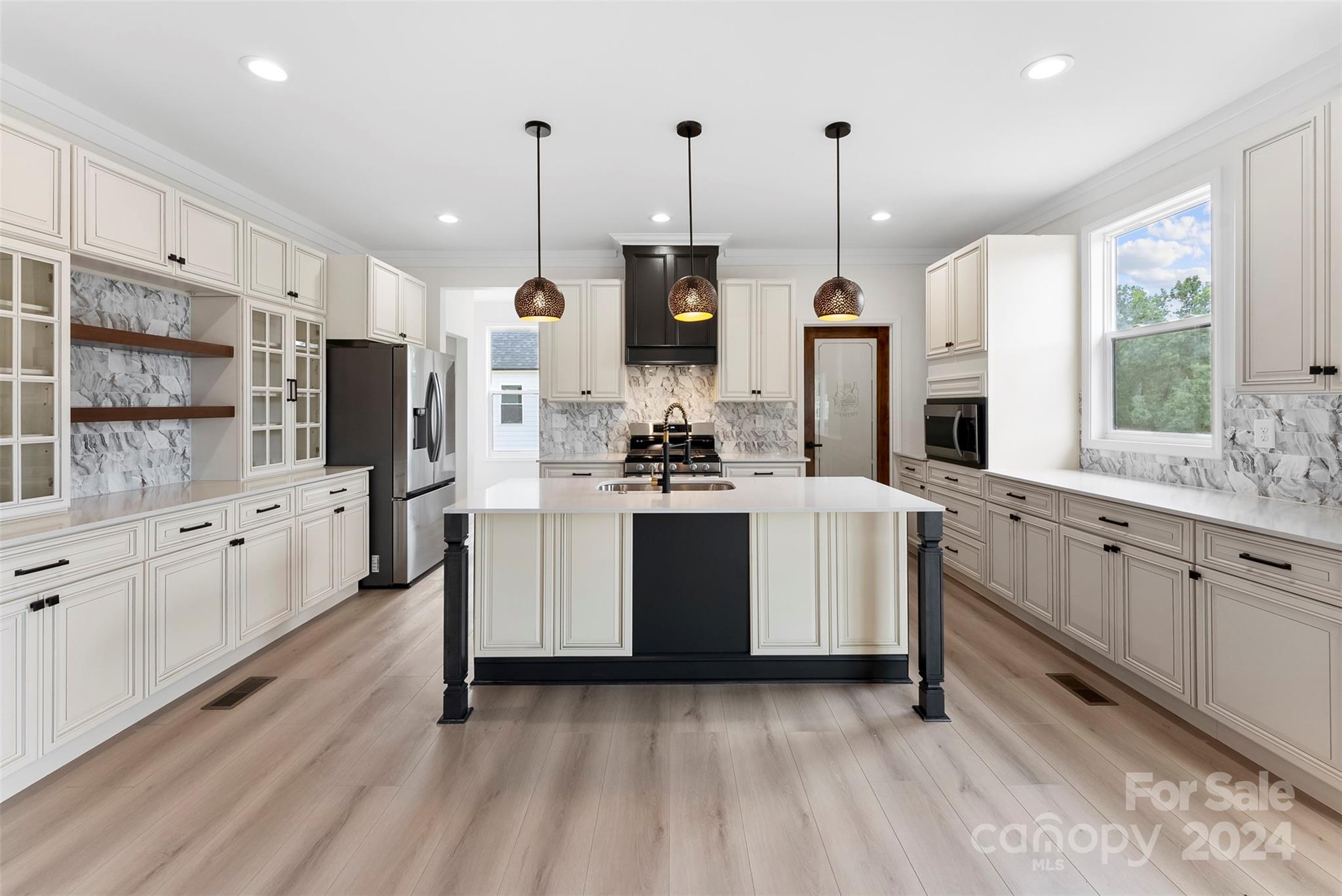 1129 Stoney Point Road Kings Mountain, NC 28086 - Photo 22 of 45 a kitchen with white cabinets and white appliances