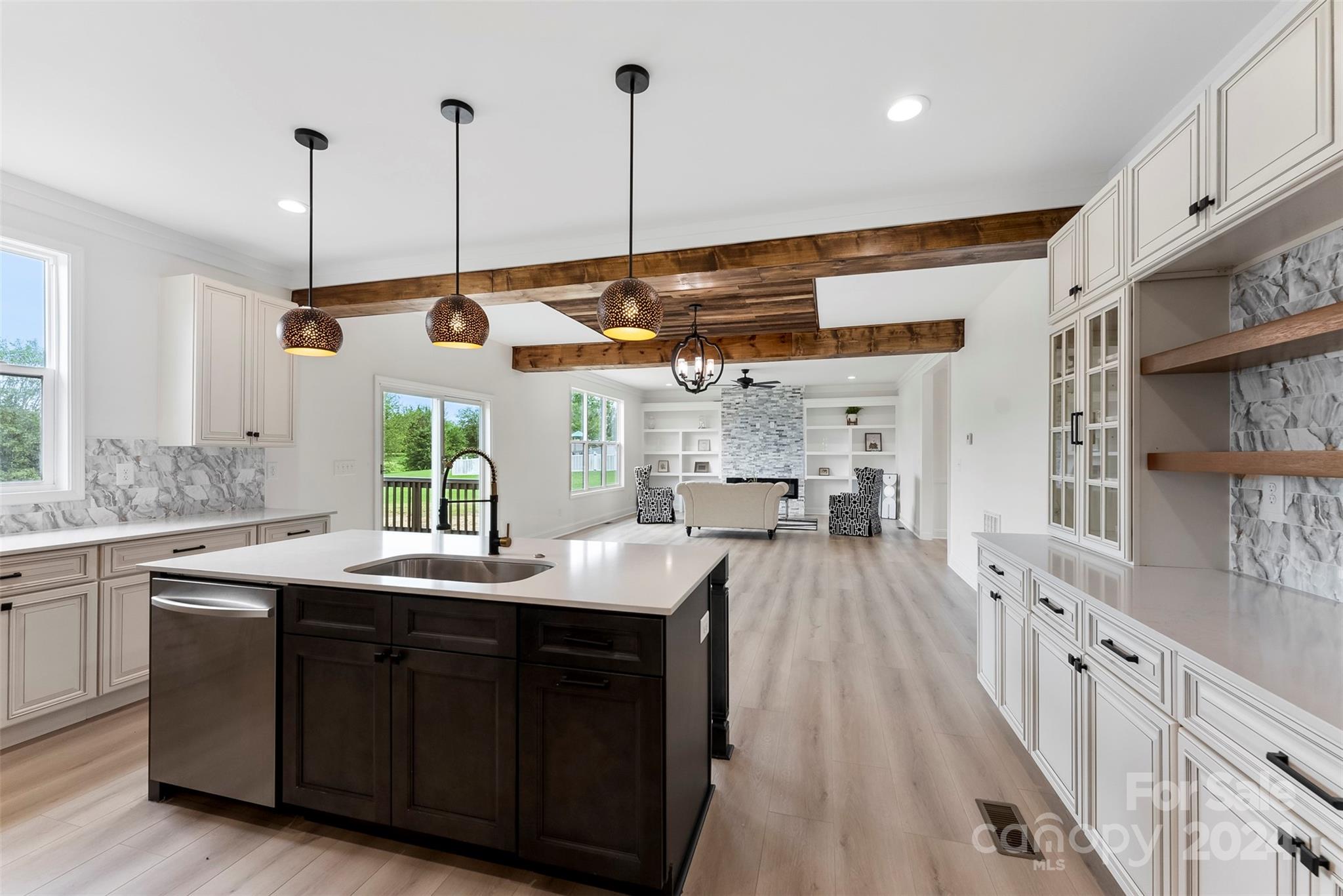 1129 Stoney Point Road Kings Mountain, NC 28086 - Photo 23 of 45 a kitchen with kitchen island granite countertop a sink a counter top space appliances and a center island