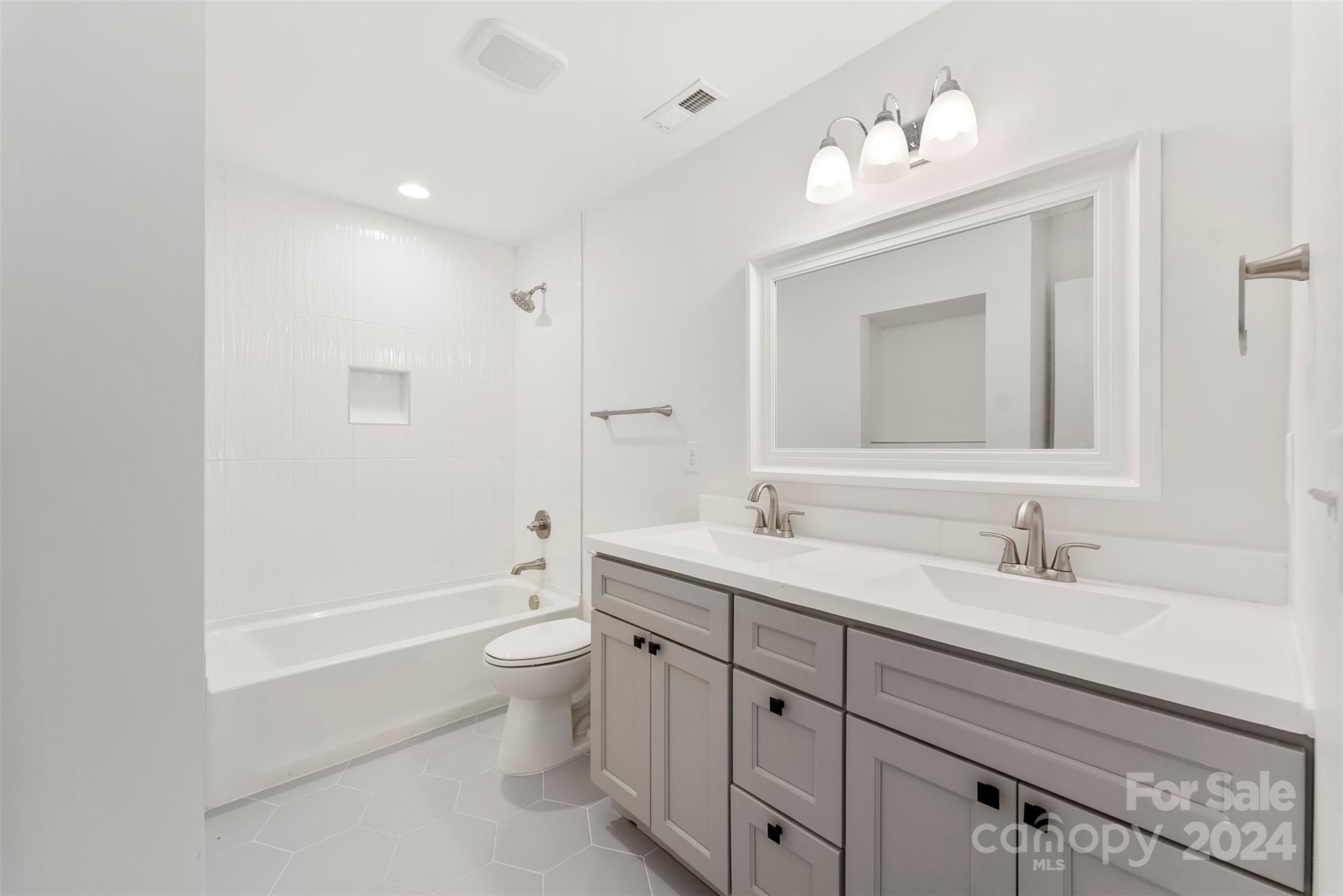 1129 Stoney Point Road Kings Mountain, NC 28086 - Photo 33 of 45 a bathroom with a double vanity sink mirror and toilet