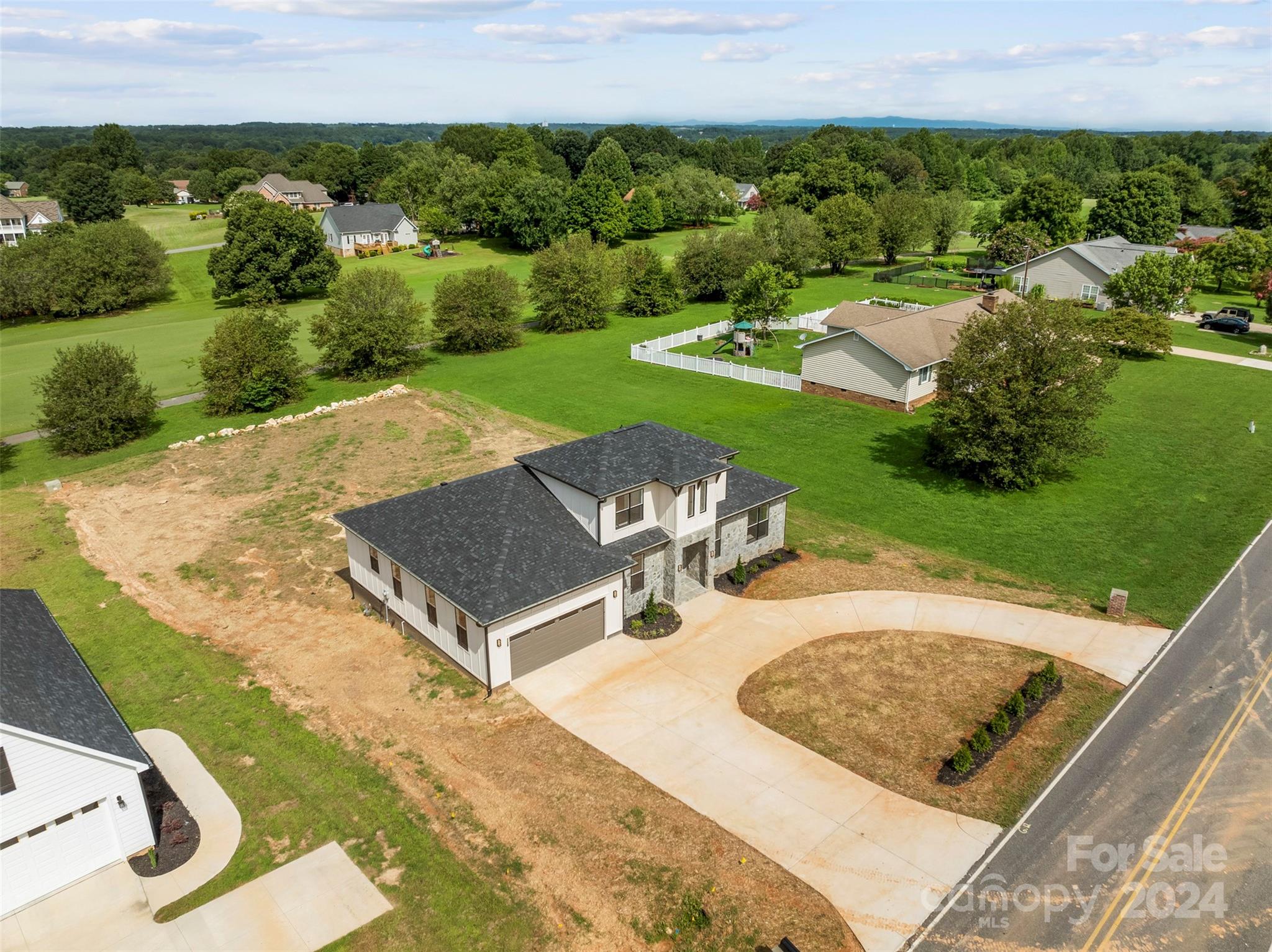 1129 Stoney Point Road Kings Mountain, NC 28086 - Photo 40 of 45 an aerial view of a swimming pool and mountain view