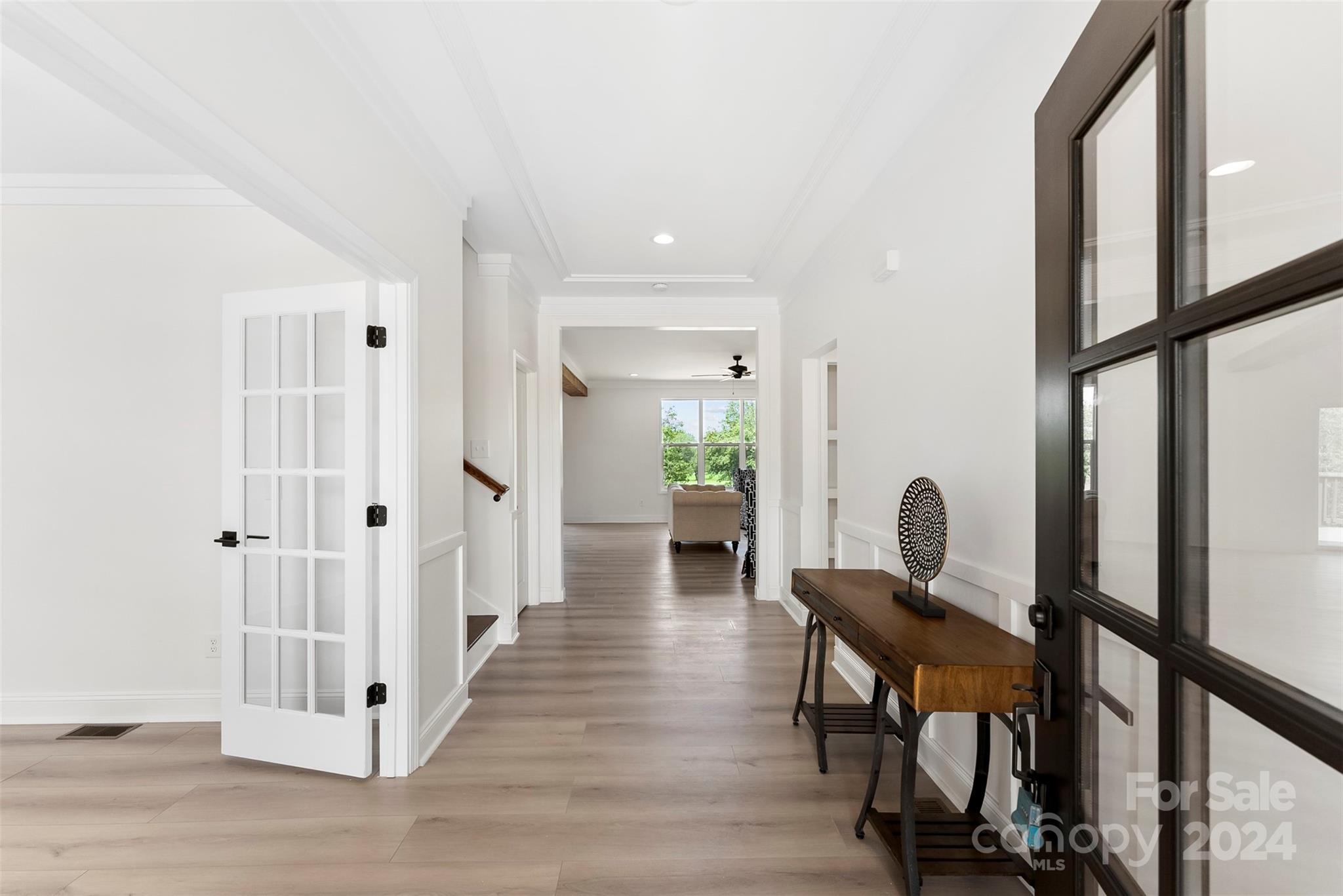 1129 Stoney Point Road Kings Mountain, NC 28086 - Photo 5 of 45 a view of a hallway with wooden floor and furniture