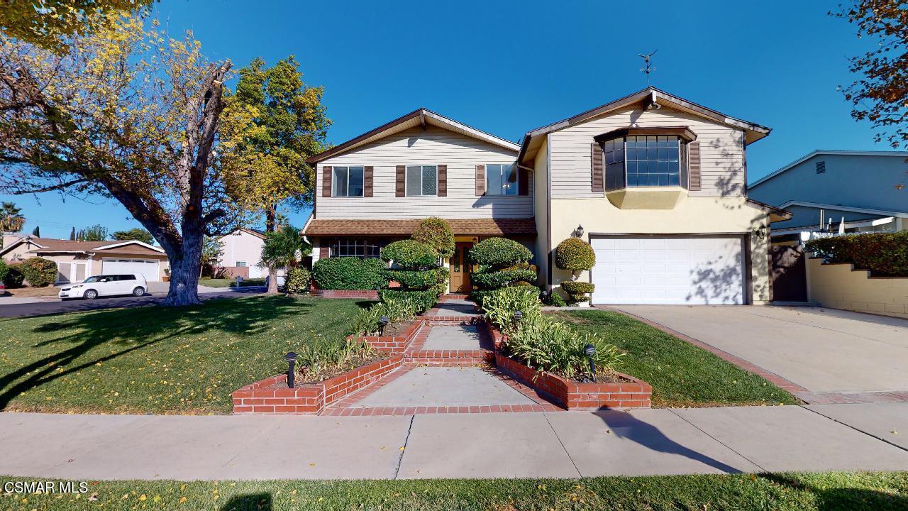 2007 Rhoda Street Simi Valley, CA 93065 - Photo 2 of 52 a front view of a house with a yard and potted plants