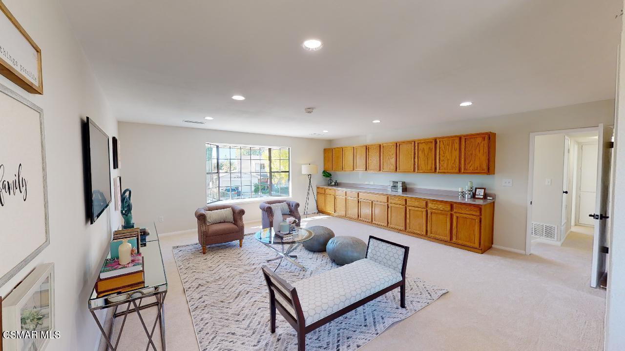 2007 Rhoda Street Simi Valley, CA 93065 - Photo 29 of 52 a living room with furniture and a flat screen tv