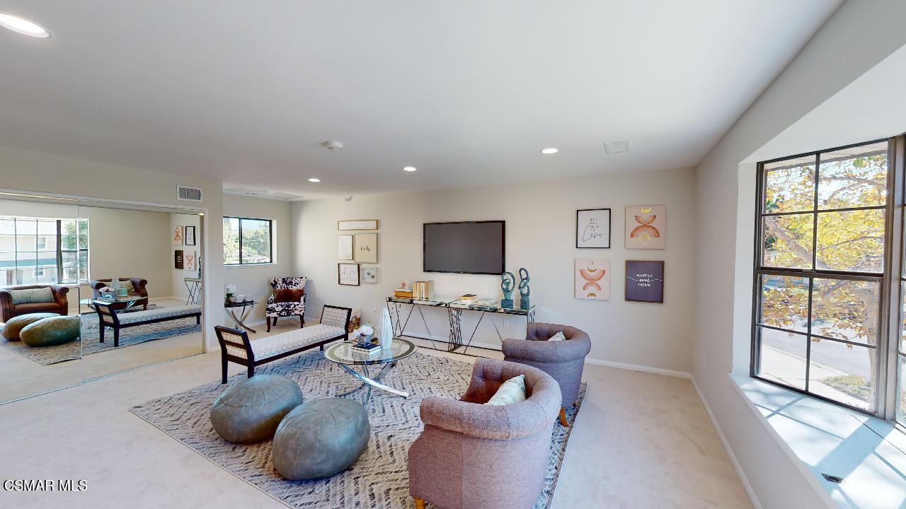 2007 Rhoda Street Simi Valley, CA 93065 - Photo 30 of 52 a living room with furniture and a flat screen tv