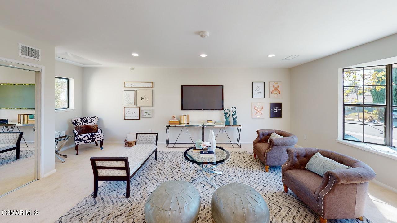 2007 Rhoda Street Simi Valley, CA 93065 - Photo 32 of 52 a living room with furniture a flat screen tv and a window