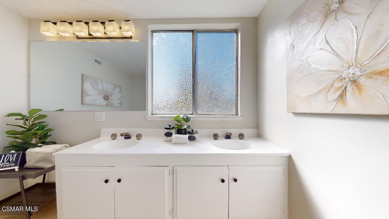 2007 Rhoda Street Simi Valley, CA 93065 - Photo 41 of 52 a bathroom with a sink and a mirror