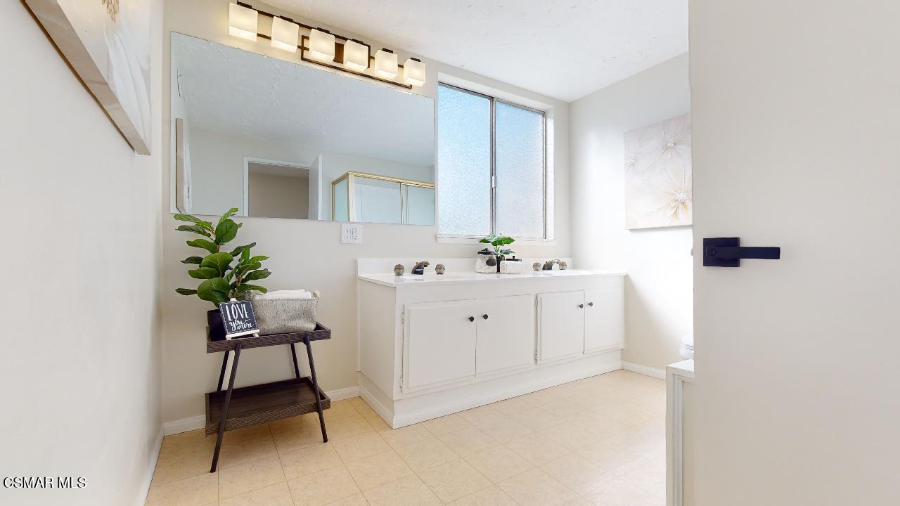 2007 Rhoda Street Simi Valley, CA 93065 - Photo 44 of 52 a spacious bathroom with a double vanity sink and a mirror