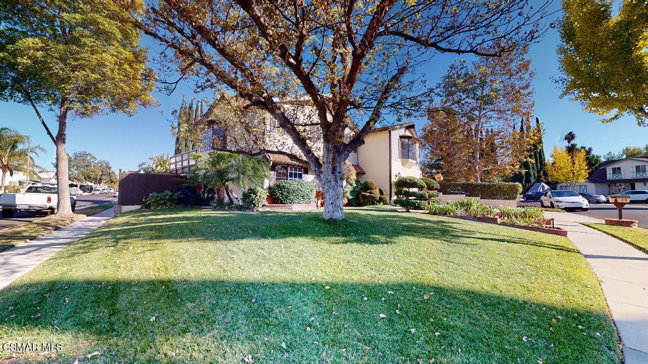 2007 Rhoda Street Simi Valley, CA 93065 - Photo 51 of 52 a view of a swimming pool with a lawn chairs and a large tree