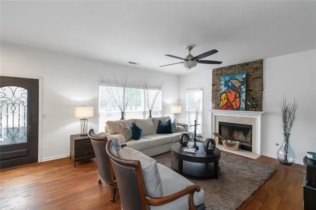 a living room with furniture and a fireplace