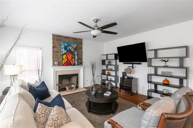 a living room with furniture and a fireplace