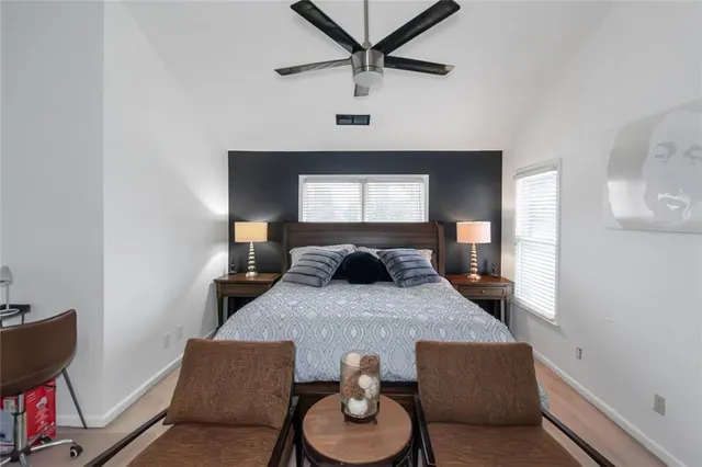 a bedroom with a bed and window