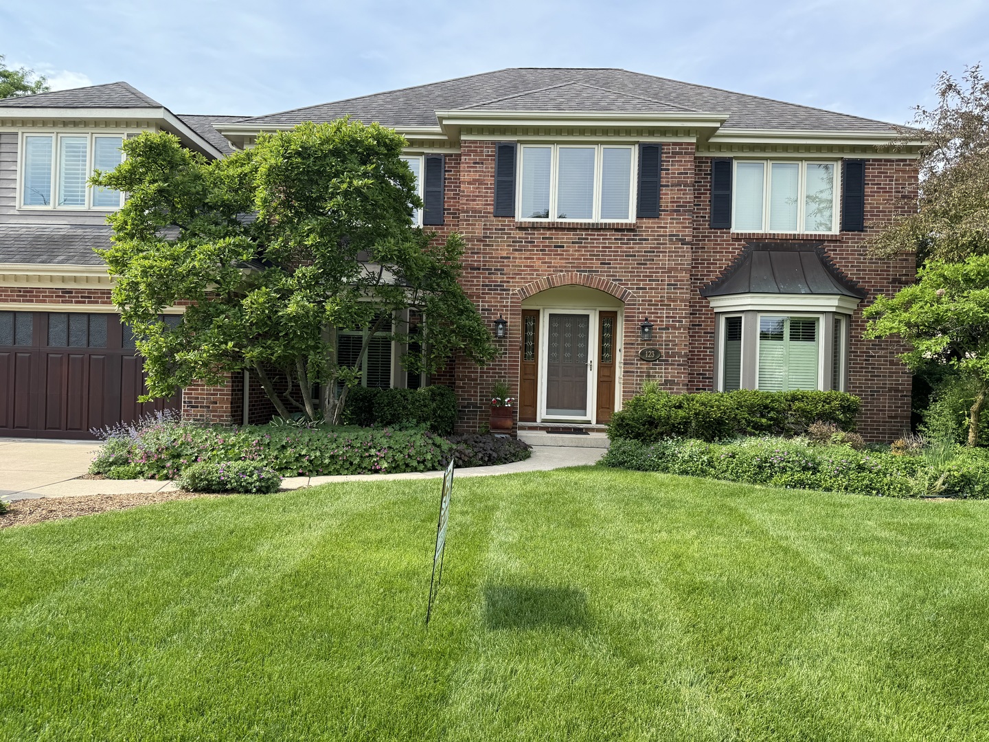 a front view of a house with a yard