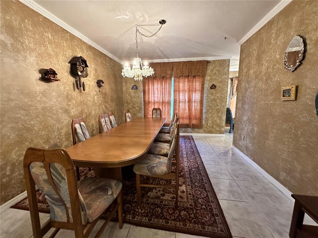 607 Gaul Way Kissimmee, FL 34759 - Photo 12 of 30 a dining room with furniture and window