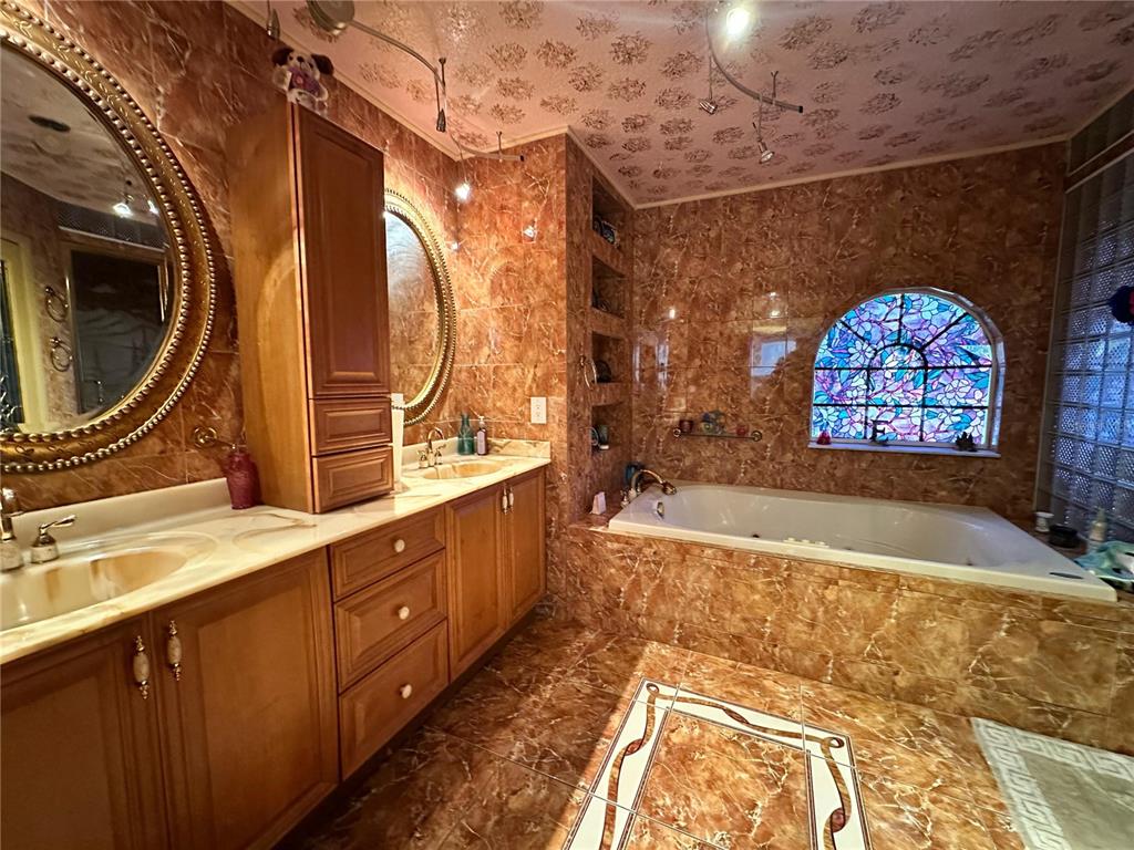 607 Gaul Way Kissimmee, FL 34759 - Photo 15 of 30 a view of a bathroom with a sink and a mirror