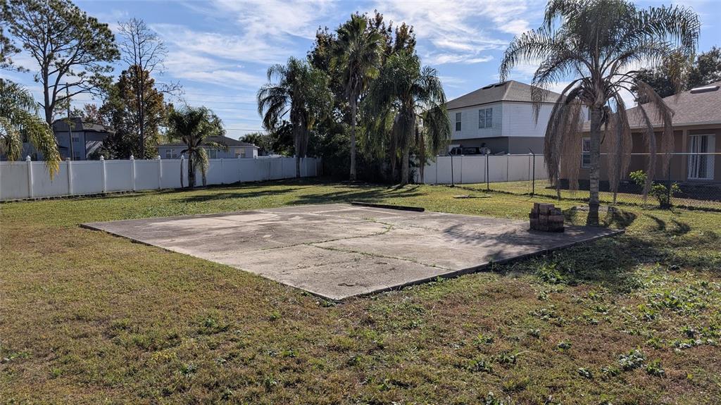 607 Gaul Way Kissimmee, FL 34759 - Photo 18 of 30 a view of a backyard with large trees