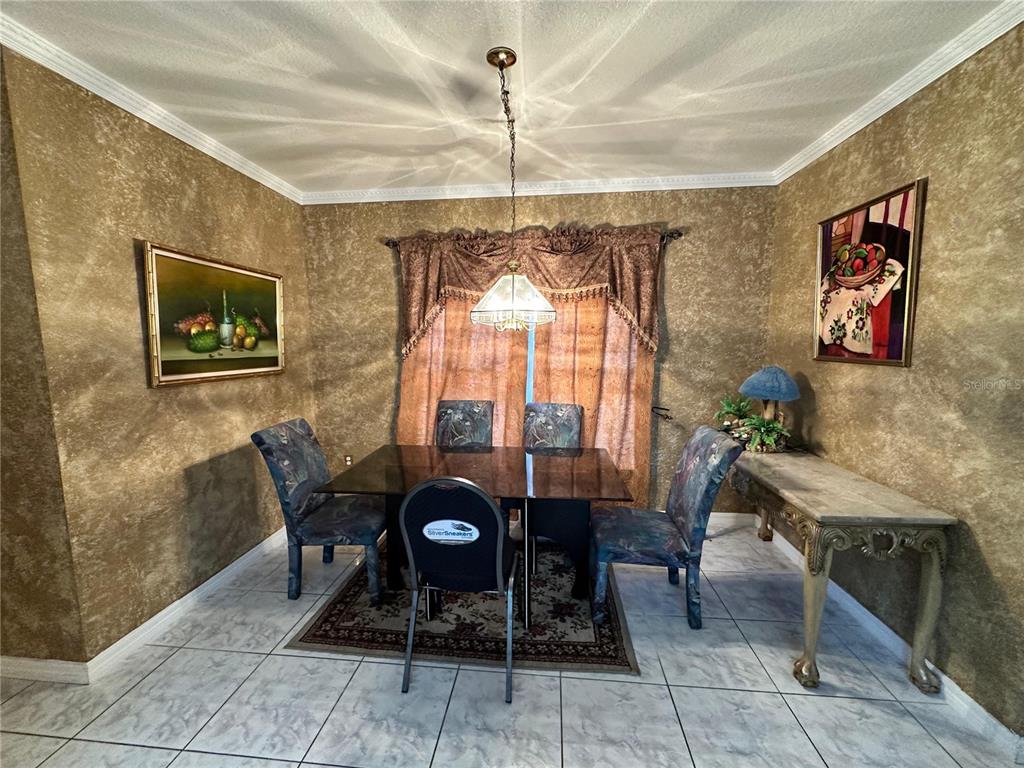 607 Gaul Way Kissimmee, FL 34759 - Photo 2 of 30 a dining room with furniture and window