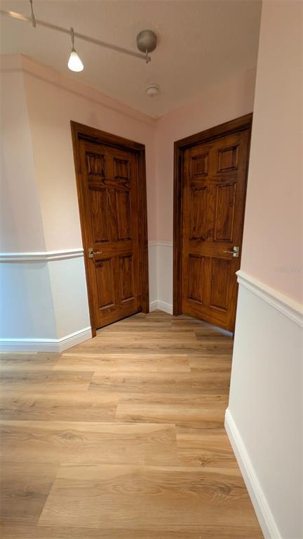 607 Gaul Way Kissimmee, FL 34759 - Photo 21 of 30 a view of an empty room with wooden floor and cabinet
