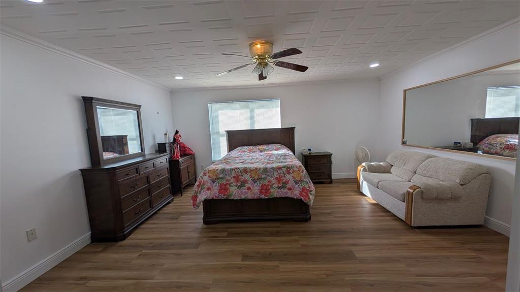 607 Gaul Way Kissimmee, FL 34759 - Photo 22 of 30 a living room with furniture and a chandelier