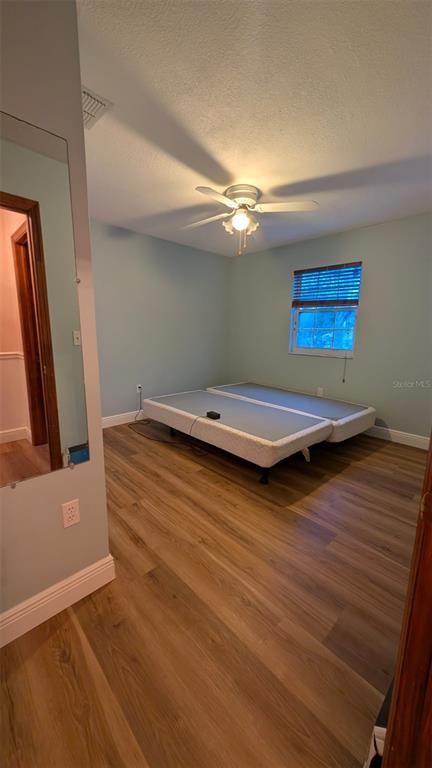 607 Gaul Way Kissimmee, FL 34759 - Photo 25 of 30 a view of a room with wooden floor