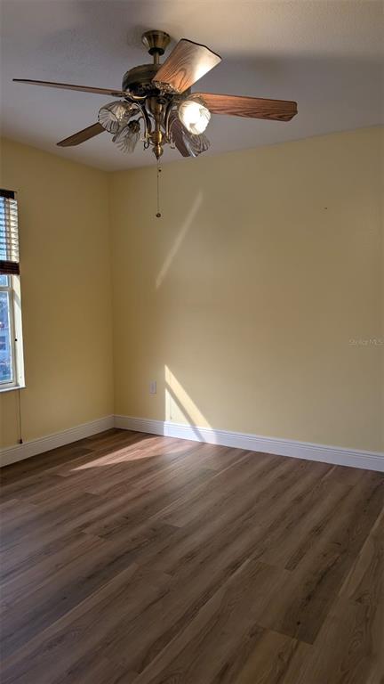 607 Gaul Way Kissimmee, FL 34759 - Photo 26 of 30 a view of an empty room with wooden floor