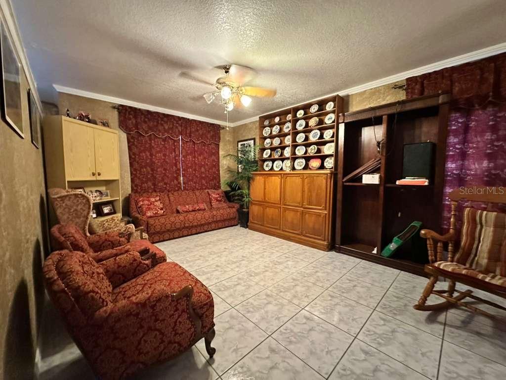 607 Gaul Way Kissimmee, FL 34759 - Photo 5 of 30 a living room with furniture a dining table and chairs