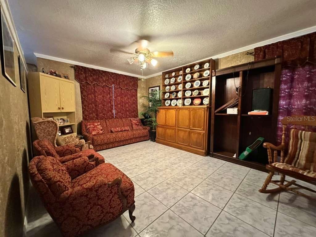 607 Gaul Way Kissimmee, FL 34759 - Photo 6 of 30 a living room with furniture a dining table and chairs
