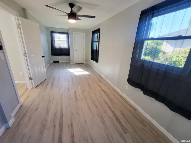 a view of a wooden deck with a yard