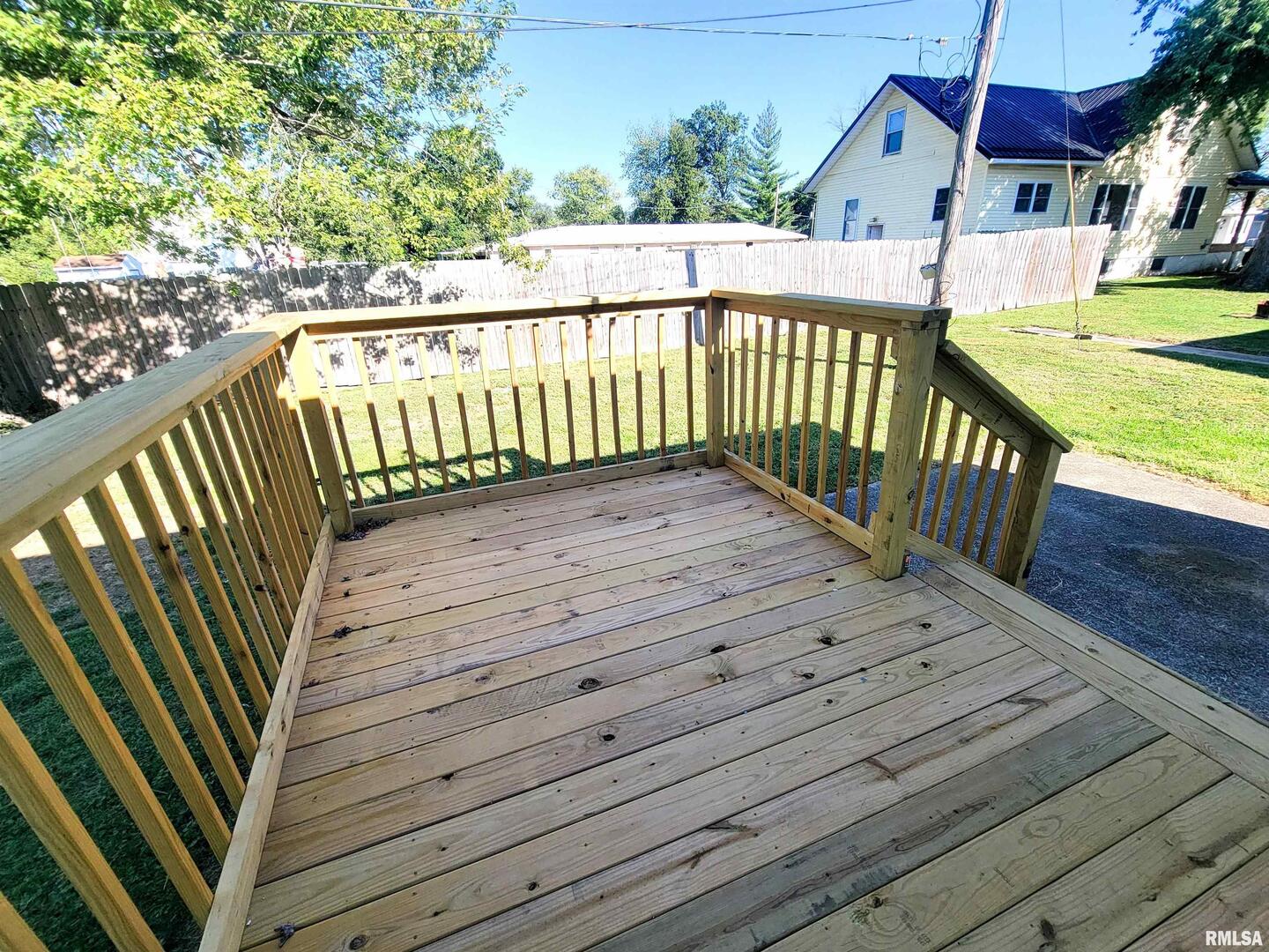 306 Bible Street Flora, IL 62839 - Photo 78 of 87 a view of a wooden deck with a yard
