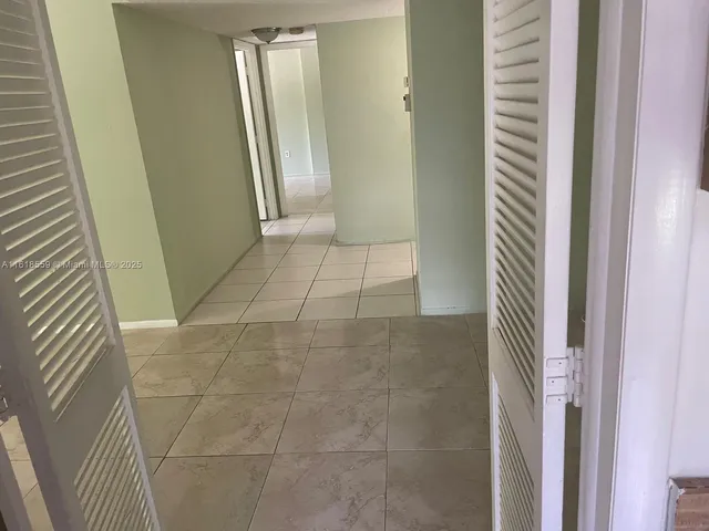 a bathroom with a sink a toilet a mirror and shower